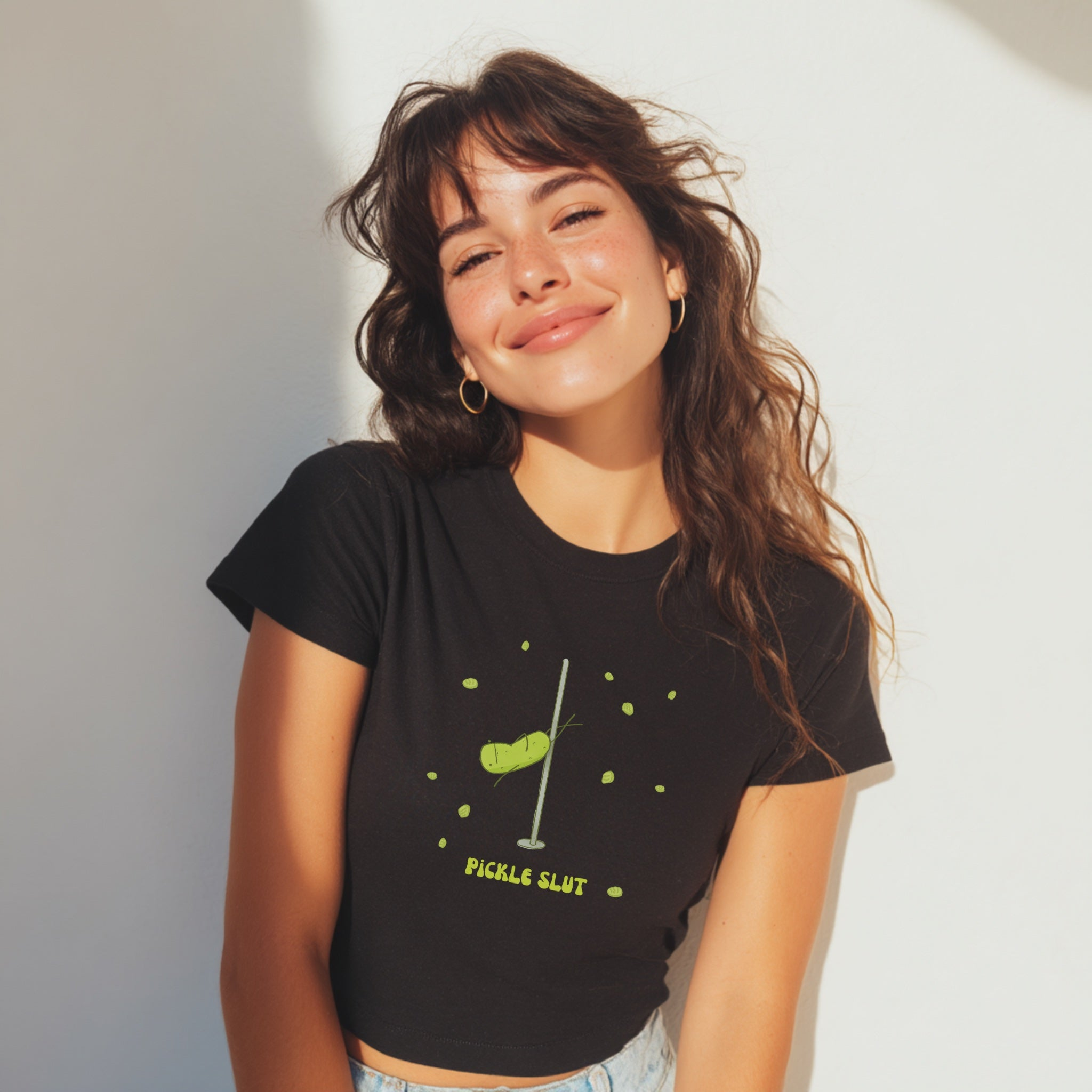 a smiling woman wearing a funny pickle slut t-shirt