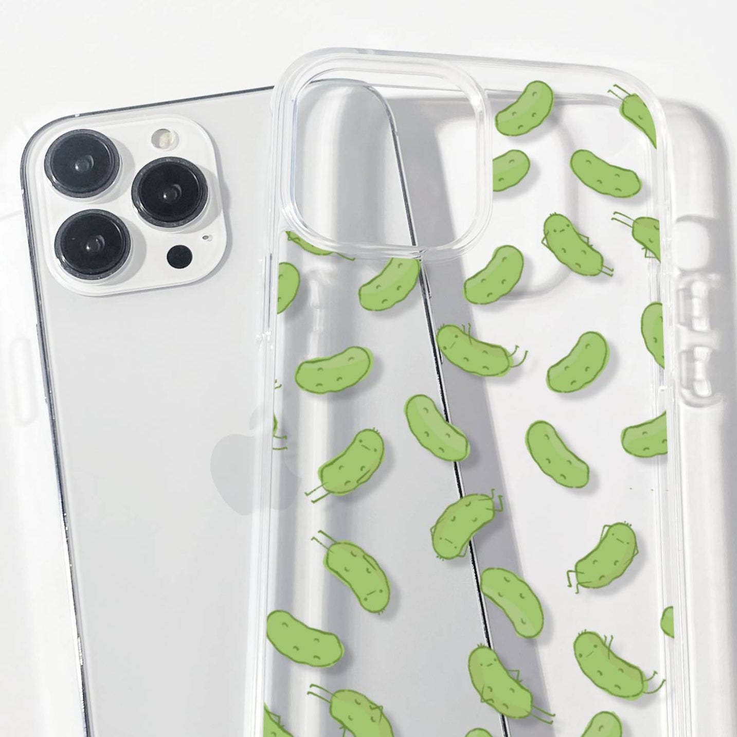 Clear Phone case with green pickle pattern on a white background