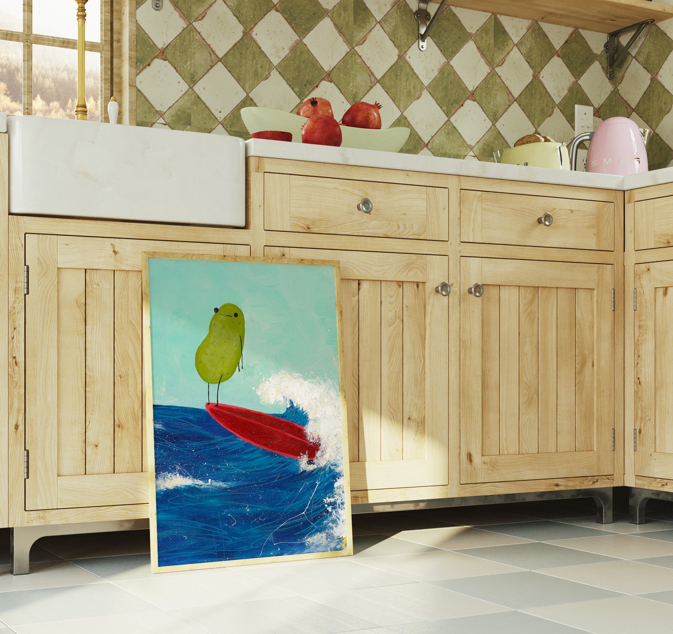 a pickle art print featuring a cute pickle riding a red surfboard on a wave is displayed in a rustic kitchen 