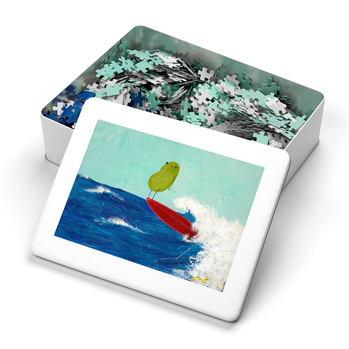 Jigsaw puzzle in a metal tin with a colorful illustration of a green pickle on a red surfboard.