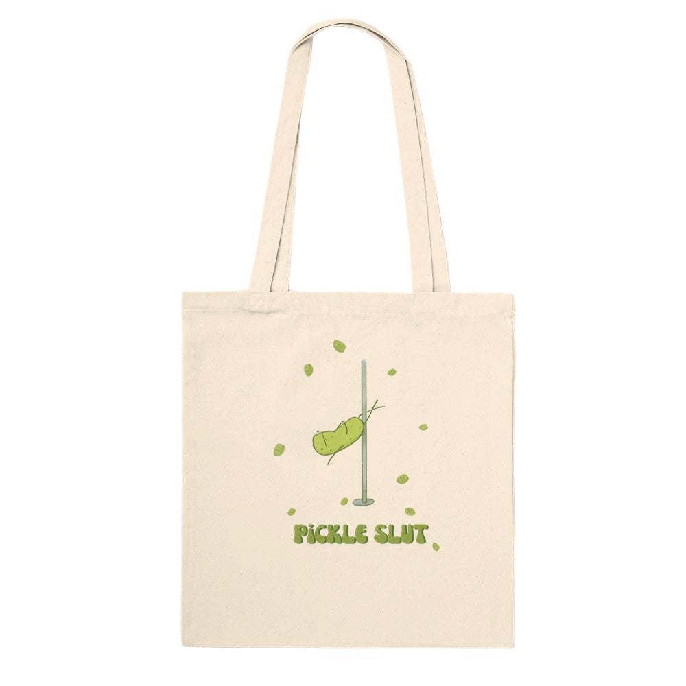a canvas tote back with a humorous design of a pole dancing pickle over text that says 'pickle slut'
